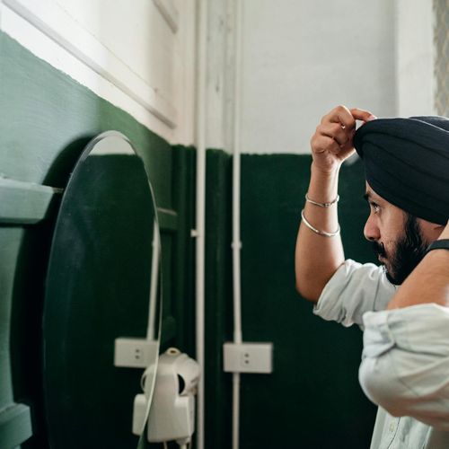 Man standing confidently after morning routine